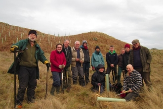 Volunteers tree planting at Eycott Hill 