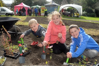 Children planting wild flowers in Vulcan Park