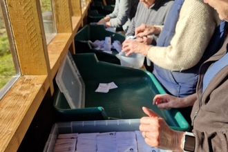 Volunteers in a potting shed