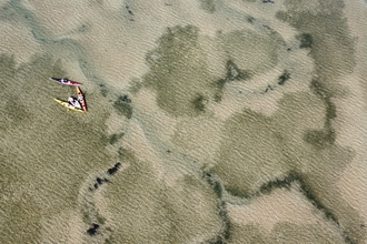 Drone view of kayakers carrying out surveys on seagrass beds in the Walney Channel, Cumbria. credit Living Seas North West