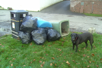 Bags of waste, a large wheelie bin and oil drum ready for the refuse centre