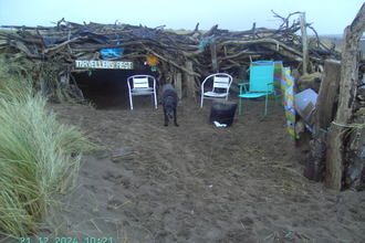 Beach den constructed by local children