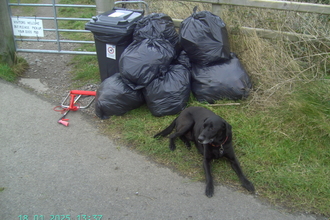 Black bin bags full of spoils removed from the beach and awaiting delivery to the recycling facility