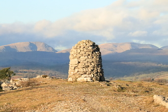 View of The Lake District fells and the cairn on Whitabarrow - Hervey Memorial reserve