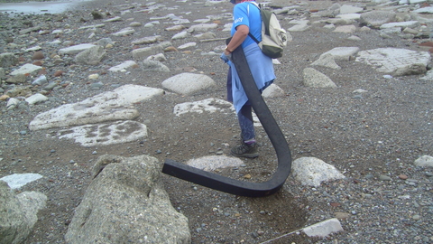 3metre length of rubber being removed from the beach