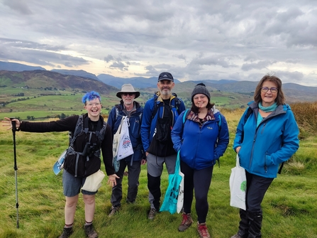 Image of seed collector volunteers in Cumbria with fells in background